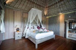 Postel nebo postele na pokoji v ubytování Uma Caming Villa Ubud