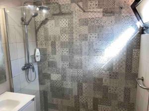 a bathroom with a glass shower with a sink at Paradise Suite - Costa Adeje in Adeje +8 photos