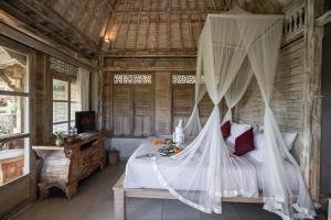 Postel nebo postele na pokoji v ubytování Uma Caming Villa Ubud