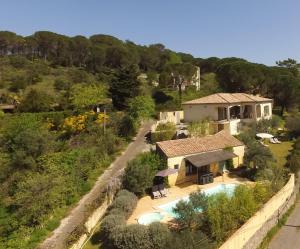 an aerial view of a house with a swimming pool at La Villa Bellevue Anduze in Anduze
