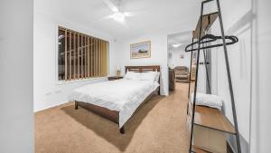 a bedroom with a bed and a ladder in it at Blue Willow Estate Bathurst in Bathurst +56 photos