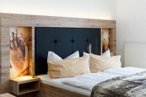 Postel nebo postele na pokoji v ubytování Wellness & Ayurveda Hotel Am Eichenberg