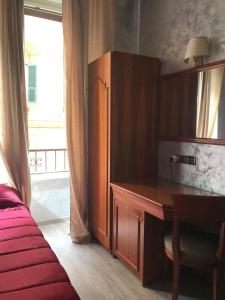 Postel nebo postele na pokoji v ubytování Sandel Giubileo Hotel