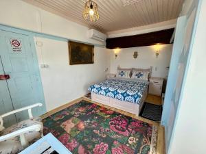 A bed or beds in a room at Mystic Konak