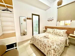 Postel nebo postele na pokoji v ubytování Hostal El Faro