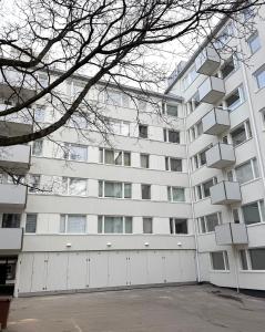a large white building with boxes on it at Spacious 2 rooms apartment in Helsinki Design District, own balcony in Helsinki