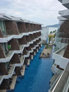 a view of the water from the balcony of a building at The beach front Condo in Ban Saiyuan (1)