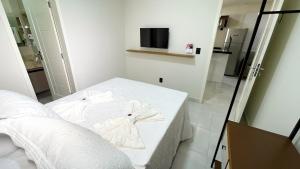 Ένα ή περισσότερα κρεβάτια σε δωμάτιο στο Residencial Bianca, Ap16 1 Andar