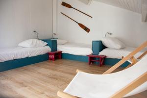 a room with two beds and a chair at Villa avec piscine, Sainte Marguerite in Pornichet +34 photos
