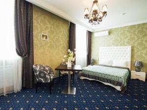 Кровать или кровати в номере Бизнес Отель Матрешка Плаза