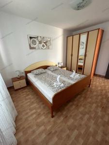 Postel nebo postele na pokoji v ubytování Valerie Apartman