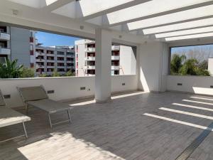 a patio with two chairs on a building at Casa vacanze in Volla