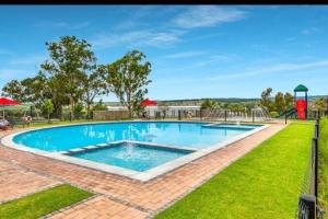 a large swimming pool in the middle of a yard at Exquisite Lavish-Luxury Apartment in Sandton
