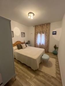 a bedroom with a large bed and a window at Alojamiento Rural Mariola in La Iruela +40 photos