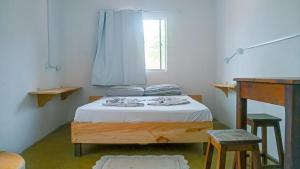 Ένα ή περισσότερα κρεβάτια σε δωμάτιο στο Hostel Jericoacoariano
