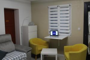 Μια τηλεόραση ή/και κέντρο ψυχαγωγίας στο Appartement climatisé dans un quartier très calme +7 φωτογραφίες