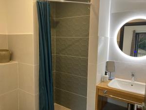 a bathroom with a shower curtain and a sink at Loumar in Saint-Tropez +118 photos