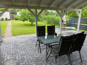 a table and two chairs on a patio at Müritz BELI in Klink
