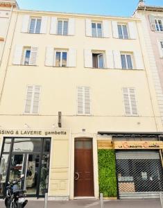 a building with a motorcycle parked in front of it at Luxury 3 bed 2 bath flat Cannes Croisette in Cannes