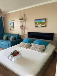 Rúm í herbergi á Couleur Caraïbes-Ti rêve appartement vue mer pierre&vacances