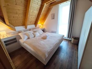Postel nebo postele na pokoji v ubytování Apartmán NIKI Apollon Resort Lednice