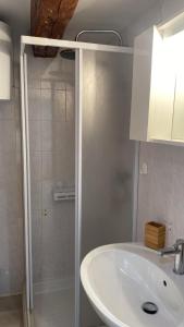 a bathroom with a sink and a shower at La Scogliera in Alghero