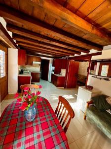 a living room with a table with flowers on it at Traditional Cypriot House - Akapanou in Akapnou +38 photos