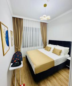 a bedroom with a bed and a chair in it at Sunny Shores Holiday in Alanya +31 photos