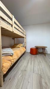 a bedroom with a bunk bed and a table at Casa Castilho in Casais