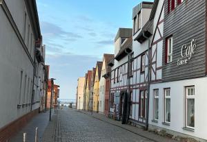 an empty street in a city with buildings at Ankerplatz Barth in Barth