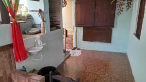a bathroom with a toilet and a sink at Casa na cidade ITAPARICA Bahia -- House in ITAPARICA town in Itaparica Town
