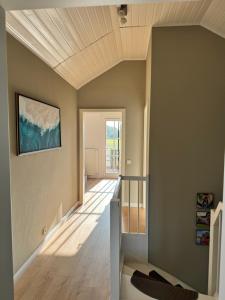 a staircase in a room with a ceiling at Haus Seeglück am Prüßsee in Güster