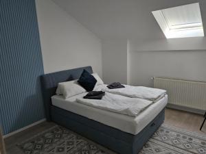 Postel nebo postele na pokoji v ubytování Berzsenyi Apartmanház