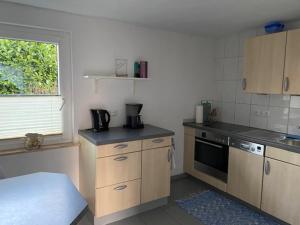 Køkken eller tekøkken på Ferienhaus am Weserradweg