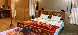 Postel nebo postele na pokoji v ubytování Narmada Homestay
