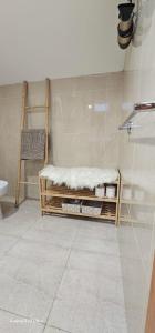 a bathroom with a shower with a bench in it at Apartamento Familia Azevedo in Esposende