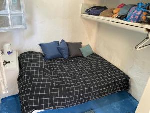 Ένα ή περισσότερα κρεβάτια σε δωμάτιο στο Casa à beira-mar em Paraty