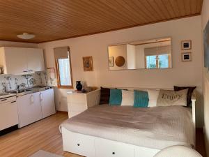 a bedroom with a large bed in a room at Linds Bed and Breakfast in Båstad