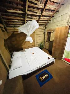 a bed in a room with a net at A9 home residence in Tangalle