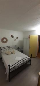 Posteľ alebo postele v izbe v ubytovaní Port Cros Appartement