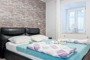 Posteľ alebo postele v izbe v ubytovaní Apartments Villa Sol