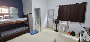 Ένα ή περισσότερα κρεβάτια σε δωμάτιο στο Loft 1 espaço inteiro térreo