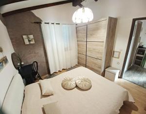 Postel nebo postele na pokoji v ubytování Apartman Marija