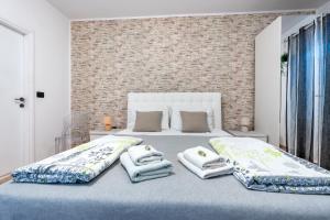 Posteľ alebo postele v izbe v ubytovaní Apartments Villa Sol