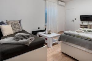 Posteľ alebo postele v izbe v ubytovaní Apartments Villa Sol