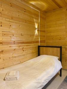 Postel nebo postele na pokoji v ubytování Bai Hotel