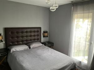 a bedroom with a large bed and a window at Altea Beach in Altea +12 photos