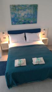 Ένα ή περισσότερα κρεβάτια σε δωμάτιο στο Casa delle ninfee vicino al lungomare