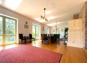 a large living room with a table and chairs at TerraVino Retreat at Lake Balaton in Balatonlelle