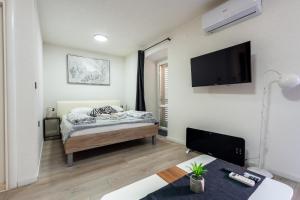 Posteľ alebo postele v izbe v ubytovaní Apartments Villa Sol